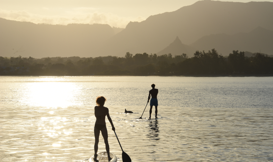People watching sunset while paddling - Veranda Resorts