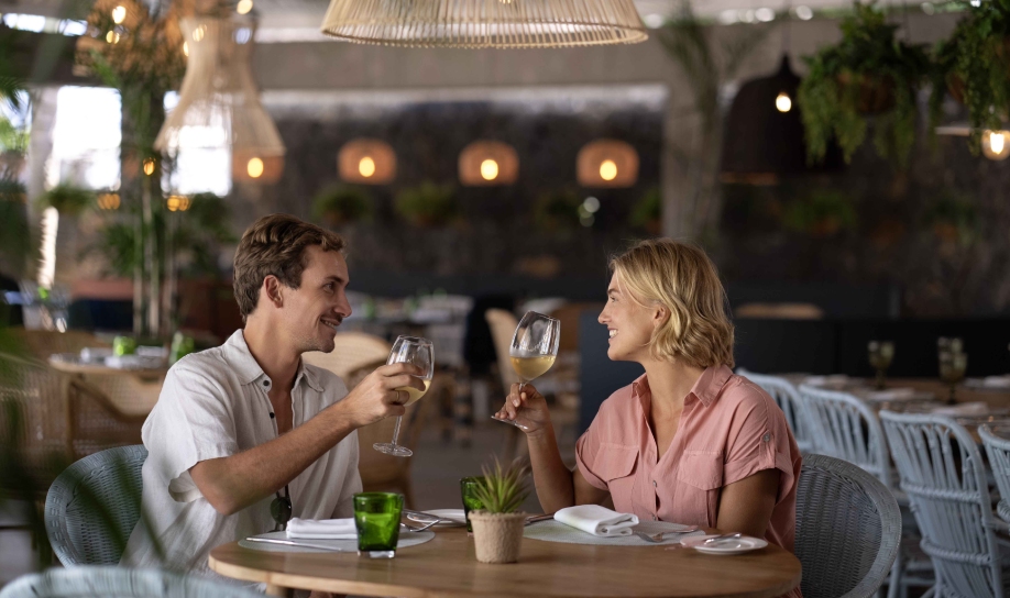 A couple enjoying a private, adult-only wing's dinner