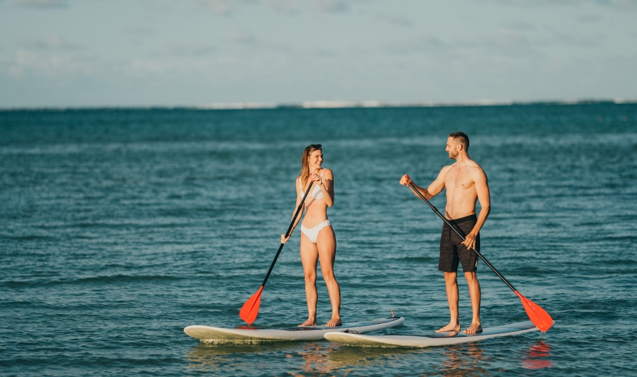 Couple enjoying a stand-up paddle adventure in Mauritius