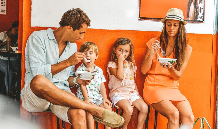 family having street foods in port-louis