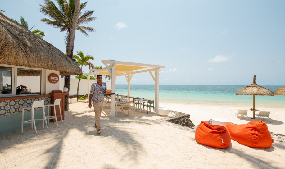Attentive beach service by a Veranda Hotels employee