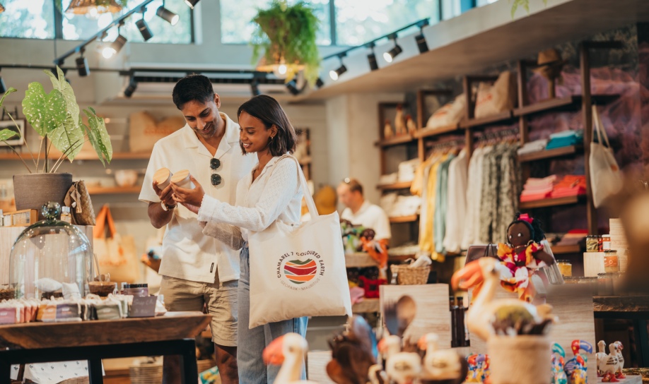 Honeymoon couple visiting Chamarel in Mauritius and buying local souvenirs
