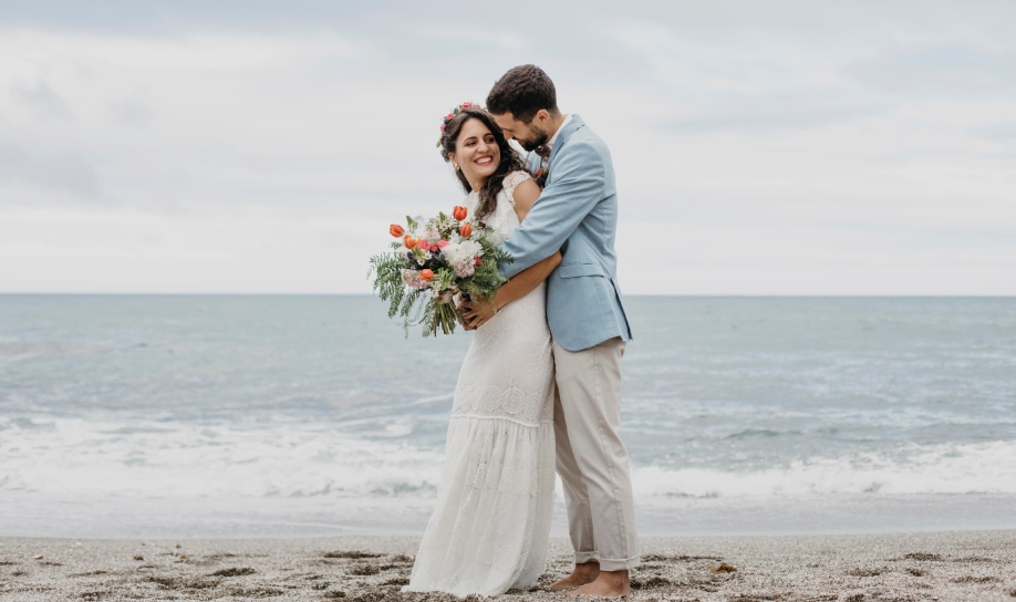 Newly married couple enjoying the sea after their wedding in Mauritius