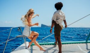 couple enjoying catamaran excursion near gunner's quoin