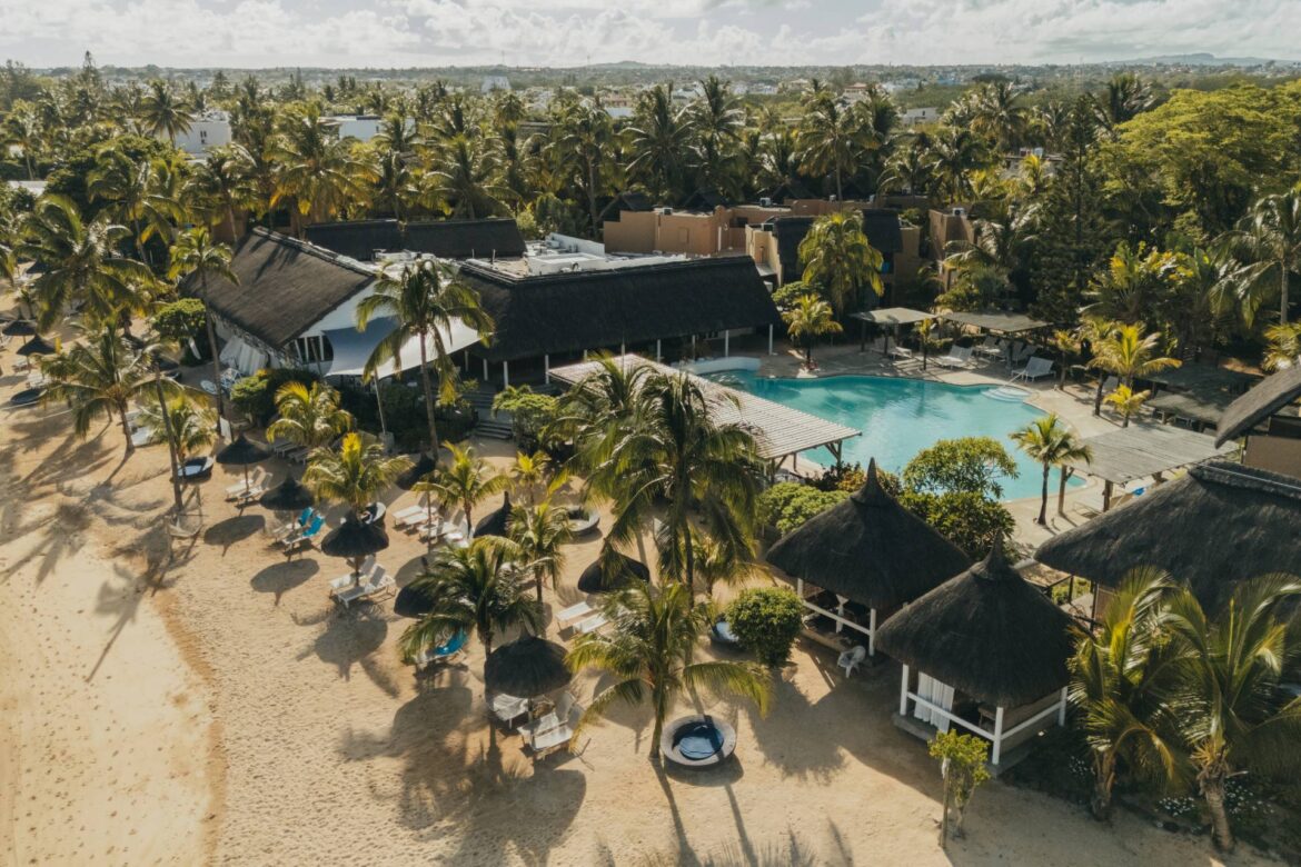 Aerial view of Veranda Pointe aux Biches Hotel, showcasing its beachfront setting, turquoise lagoon